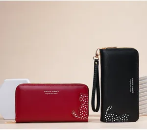Stylish long PU leather women wallet with cute cat detail, large capacity and wrist strap.