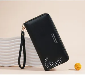 Detail of black long PU leather wallet with cat design, wrist strap and zipper closure.