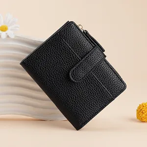Elegant black textured women short wallet with zipper coin purse, stylish bi-fold card holder.