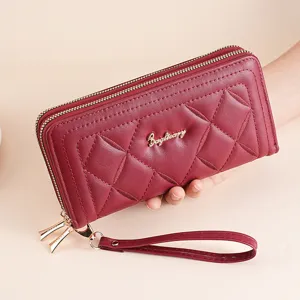Women's long quilted wallet with double zippers and wrist strap, wine red fashion purse.