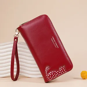 Red PU leather long women wallet with wrist strap and cute cat pattern, stylish clutch bag.