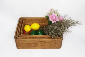 Detailed view of handmade natural rattan storage basket, woven rectangular desktop organizer box.
