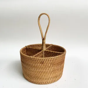 Close-up view of the hand-woven rattan storage basket showing fine texture and interior dividers.