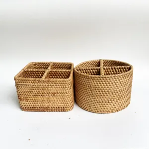 Detailed view of the woven rattan desktop organizer with multi-compartments for neat storage.
