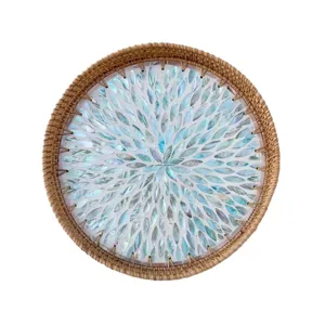 Handcrafted round rattan serving tray with colorful mother of pearl shell mosaic inlay for home.