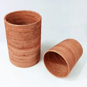 Handmade natural rattan storage basket, round woven scroll holder and wastepaper basket.