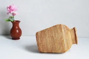 Nordic woven rattan vase detail, rustic retro decorative flower holder for home decor.