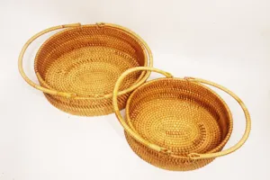 Handwoven rattan storage basket set with handles, rustic style fruit and snack organizer.