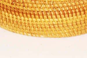Close-up detail shot of natural woven rattan texture, showing exquisite craftsmanship and design.