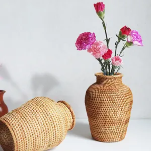 Nordic style woven rattan flower vase, rustic decorative floral arrangement container for decor.