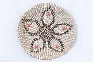 Handmade seagrass woven decorative plate for living room wall hanging or home decor display.