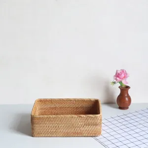 Handmade rectangular woven rattan storage basket detail view with a floral decor.