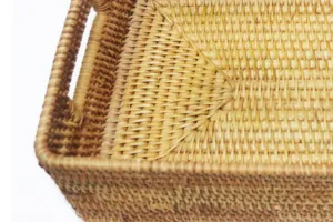 Detailed close-up shot displaying the delicate handmade texture of the woven rattan storage tray.