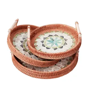 Rattan woven storage tray with wooden handles and colorful shell mosaic inlay for home decor.