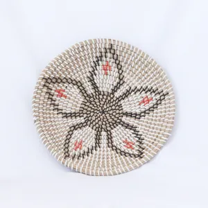 Natural seagrass woven decorative wall hanging plate, handmade rustic tray for home decor.