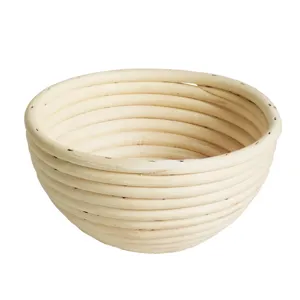 Handmade natural rattan bread proofing basket, round shaped banneton for home baking.