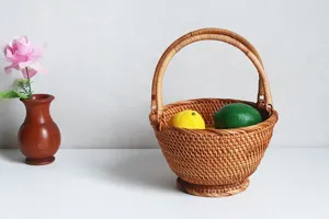 Handmade rattan woven fruit basket detail showing natural texture and neat handicraft construction.
