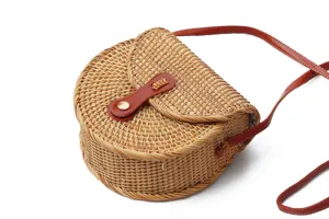 Round rattan straw crossbody bag, vintage bohemian style shoulder bag with brown leather strap.