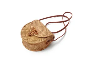 Woven rattan detail of the round crossbody bag, showing natural texture and leather strap.