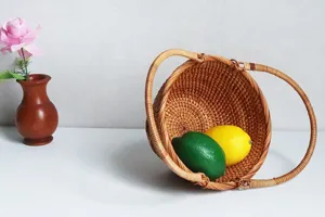 Detailed view of handmade woven rattan fruit basket, tabletop decorative storage container.