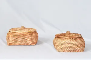 Natural handmade rattan storage basket detail, woven wicker organizer box with lid for home decor.