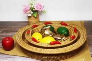 Detailed view of woven rattan fruit basket, round nesting tray for living room snacks.