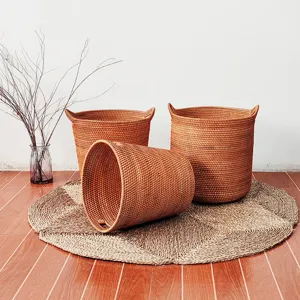 Detailed shot of woven rattan storage baskets set in a clean home interior display arrangement.