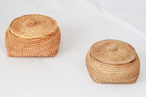 Close-up detail of hand-woven rattan storage box showing fine natural texture and neat weave.