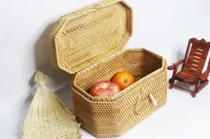 Handmade woven rattan storage box detail, natural material, close-up craft view.