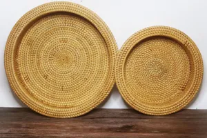 Handwoven natural rattan fruit and snack tray set, detailed view of round wicker storage baskets.