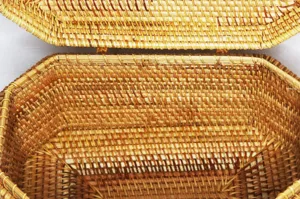 Close-up detail of handmade rattan woven storage box showing exquisite texture and craftsmanship.