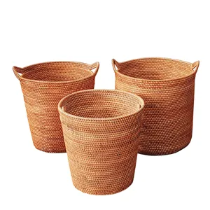 Handwoven rattan storage basket set, round wicker hamper for home organization and laundry.