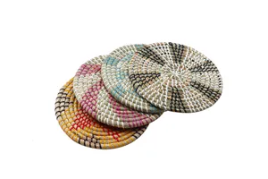 Detailed view of woven straw heat insulation mat, natural kitchen pot and bowl coaster.