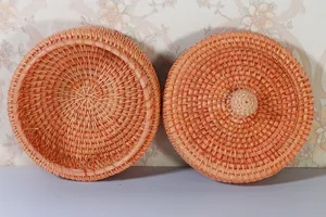 Round Vietnamese rattan storage box with lid, handmade woven organizer for desktop and nuts.