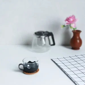 Handwoven natural rattan drink coaster for home tea cup and teapot heat insulation pad.