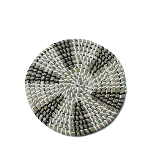 Round natural straw woven thermal insulation mat for kitchen pot, bowl and kettle holder.