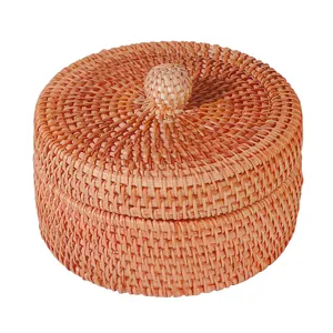 Round lidded Vietnamese rattan storage box for desktop sundries and nuts organization.