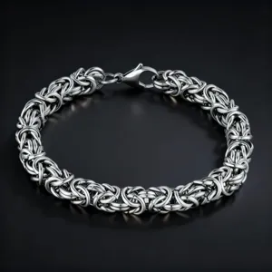 Detailed close-up of intricate Byzantine chain link silver bracelet for men fashion jewelry.