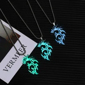 Detailed view of luminous dragon pendant necklaces with glowing green and blue flame design.