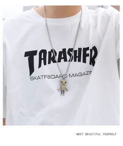 Close up of retro bronze robot pendant necklace streetwear hip hop style detailed shot photo