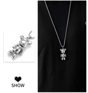 Detailed view of hip-hop silver bear pendant necklace, showcasing fine texture and design.