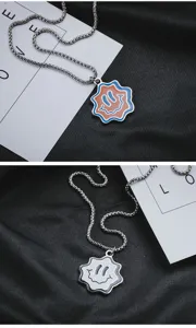 Detailed view of the trendy wavy smiley face titanium steel hip-hop pendant necklace for street wear.