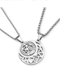 Detailed shot of titanium steel sun and moon hollow couple necklace with sparkling rhinestones.