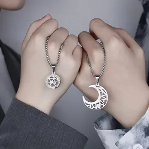Matching sun and moon couple necklaces with cutout pendant design in stainless steel.