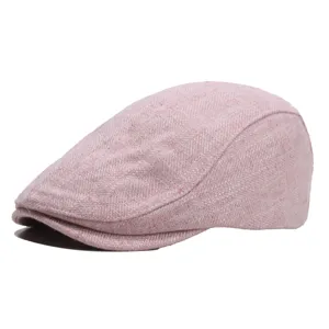 Pink tweed newsboy cap detail, vintage ivy hat close-up, textured fabric flat cap style.
