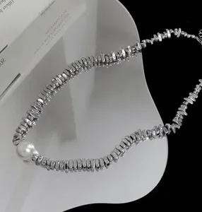 Trendy irregular metallic chip necklace with pearl detail, unisex hip-hop niche design jewelry.