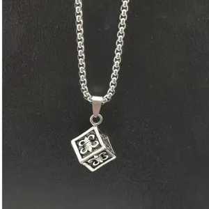 Detailed view of men hip-hop cube pendant necklace, vintage silver stainless steel.