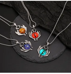 Gothic dragon evil eye pendant necklace set detail showcasing unique metal wing design.