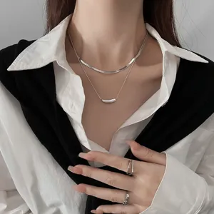 Detailed close-up view of the double-layer snake bone necklace and pendant design.