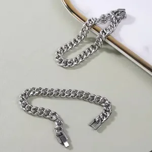 Stainless steel Cuban link chain bracelet for men and women, stylish couple jewelry design.